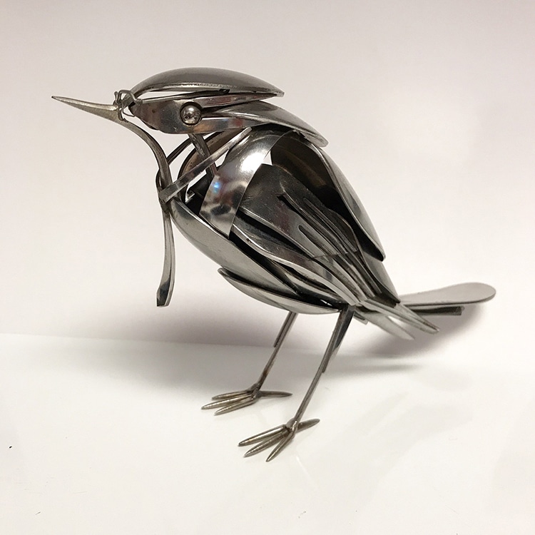 cute little bird sculpture made of spoons and such